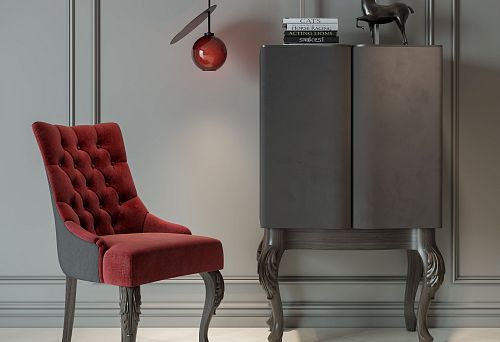 Современный стул с мягкой бархатной обивкой и резными деревянными ножками на фоне минималистичного интерьера