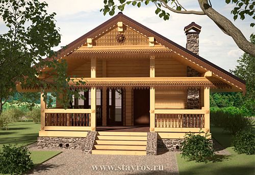 Деревянный дом с декоративными резными украшениями фасада